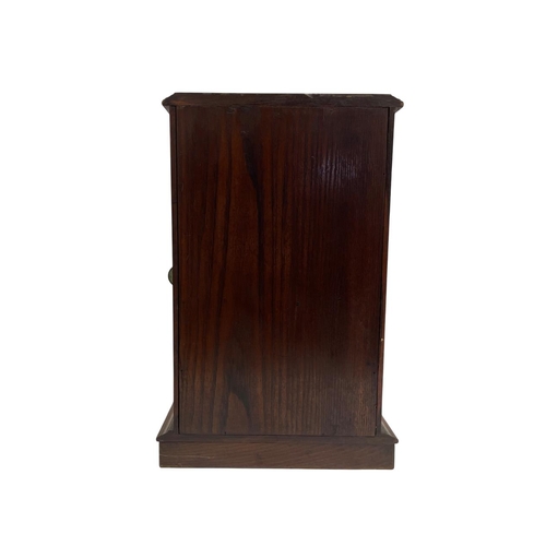 502 - Edwardian oak smokers cabinet with bevelled glazed door and fitted three draw interior having origin... 