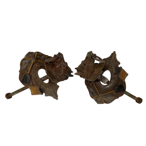 622 - Pair of French cast iron wall mounting stable horse tethers modelled as horse heads and saddles, cir... 