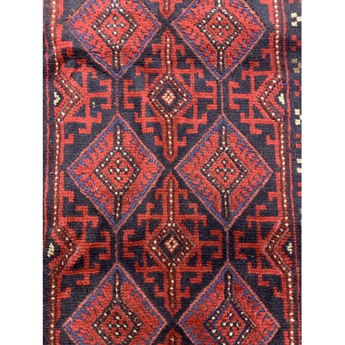 1669 - Meshwani runner with red ground, 239cm x 58cm