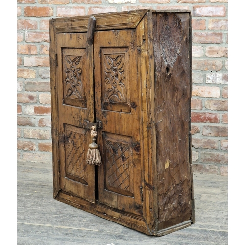 1382 - 18th century rustic cabinet with carved fielded panels and twin cupboard doors revealing a shelved i... 