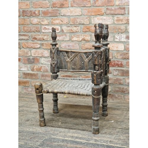 1404 - Antique carved primitive Tribal corner chair with woven seat, H 83cm x W 77cm x D 72cm