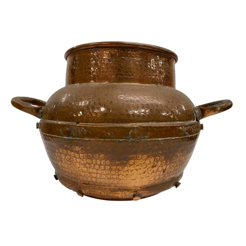 552 - Quantity of copper kitchenware to include a beaten copper circular studded pot, H 25cm, kettle, oval... 