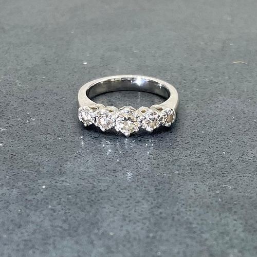 54 - Exceptional quality platinum diamond five stone ring, central stone 0.3ct, size H 1/4, 5.3g