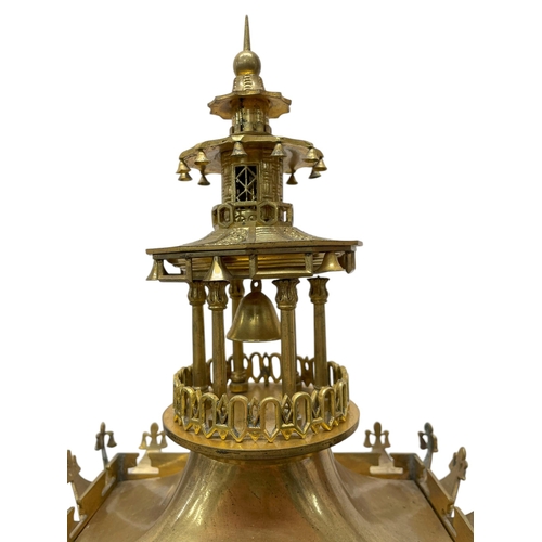 215 - After Theodore Leroy (1788-1839) - A Chinese style gilt metal portico clock in the form of a pagoda,... 