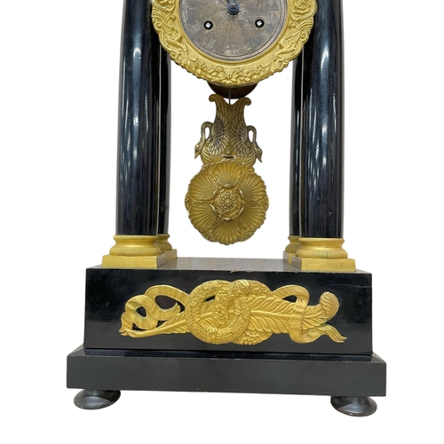 216 - Unusual 19th Century French ebonised and ormolu portico clock, the 8.5cm silvered dial with Roman nu... 