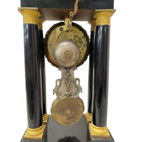 216 - Unusual 19th Century French ebonised and ormolu portico clock, the 8.5cm silvered dial with Roman nu... 