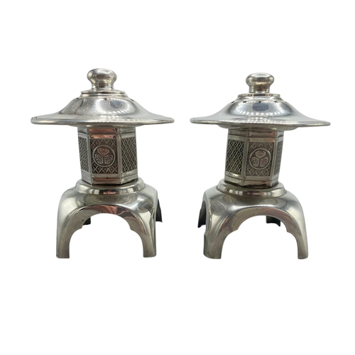 107 - Novelty pair of Sterling silver pagoda salt and pepper, 8cm high, 3oz approx