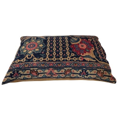 1641 - Three large cushions, the covers being cut from an antique Persian rug, largest 130cm x 70cm (3)