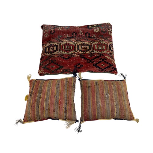 1639 - Collection of cushions, the covers being cut from an antique Persian rug, together with an impressiv... 