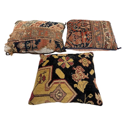 1639 - Collection of cushions, the covers being cut from an antique Persian rug, together with an impressiv... 