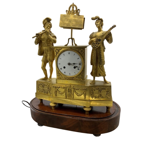 205 - Impressive French ormolu figural musical mantle clock, the twin train train enamel dial flanked by a... 