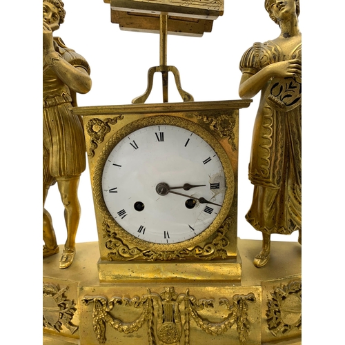 205 - Impressive French ormolu figural musical mantle clock, the twin train train enamel dial flanked by a... 