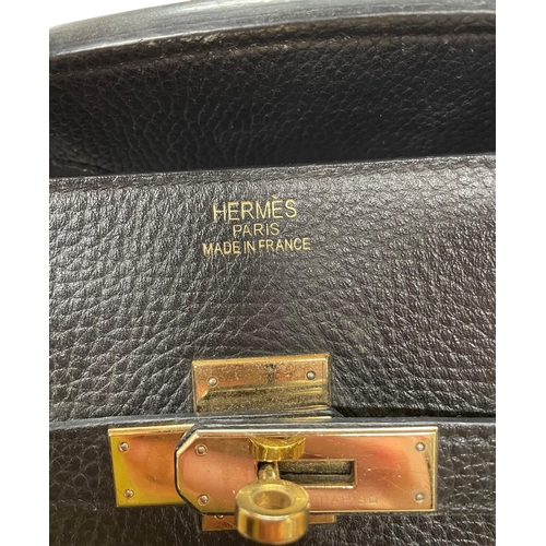 162 - Hermès Black Birkin 40 Togo leather handbag, having polished gold-tone hardware, dual rolled leather... 