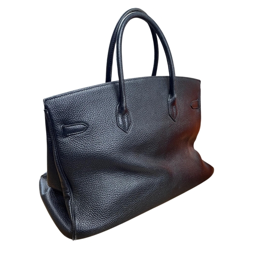 162 - Hermès Black Birkin 40 Togo leather handbag, having polished gold-tone hardware, dual rolled leather... 