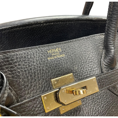 162 - Hermès Black Birkin 40 Togo leather handbag, having polished gold-tone hardware, dual rolled leather... 