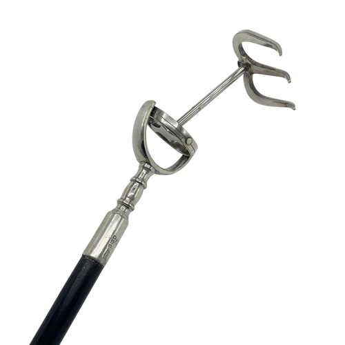 118 - George V Asprey toasting fork, with ebonised shaft, the fork secured via a gimble mechanism, the sil... 