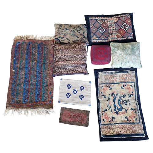 1702 - Collection of mixed textiles to include prayer mats, cushions etc (9)