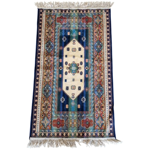 1704 - Small silk Persian rug with geometric medallions, on a blue ground, 122cm x 66cm