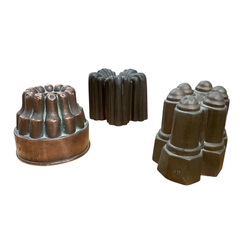 524 - Three antique copper jelly moulds, the tallest 12cm (3)