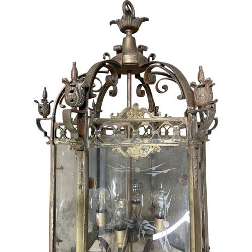 1062 - Exceptional quality brass framed glass hall lantern, six etched glass concave panels on a scrolled f... 