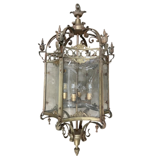 1062 - Exceptional quality brass framed glass hall lantern, six etched glass concave panels on a scrolled f... 