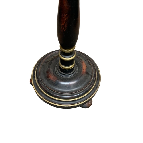 1129 - Ebonised Edwardian standard lamp atop three footed stepped circular base, H 160cm