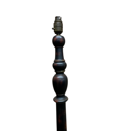 1129 - Ebonised Edwardian standard lamp atop three footed stepped circular base, H 160cm