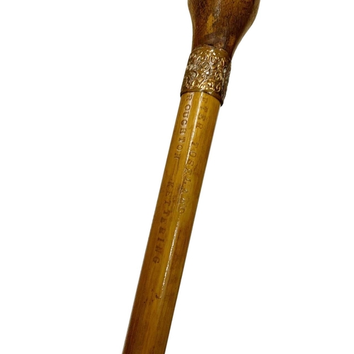 648 - Folk Art composite walking cane with hardwood handle carved as a foot, having ornate scrolled copper... 