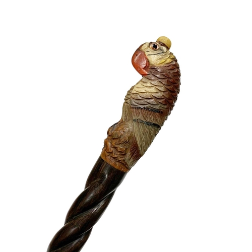 650 - Hardwood walking cane with carved and painted full parrot handle with inset glass eyes, having hardw... 