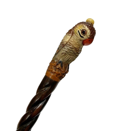 650 - Hardwood walking cane with carved and painted full parrot handle with inset glass eyes, having hardw... 