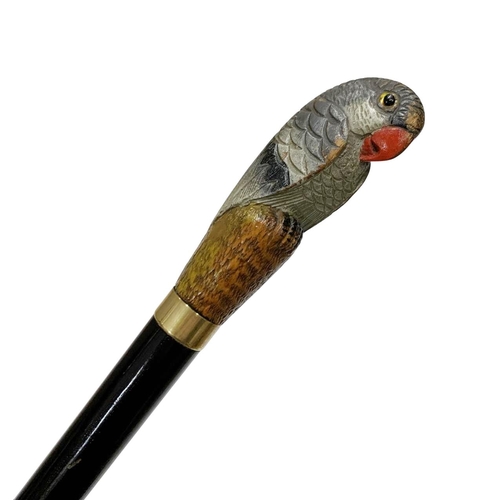 651 - Varnished hardwood shaft walking cane with carved and painted full parrot handle having inset glass ... 