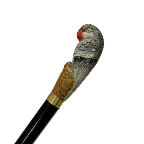 651 - Varnished hardwood shaft walking cane with carved and painted full parrot handle having inset glass ... 