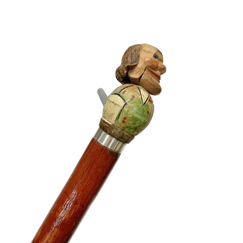 656 - Folk Art stained red hardwood automaton walking cane of balding gentleman, depressing the lever leng... 