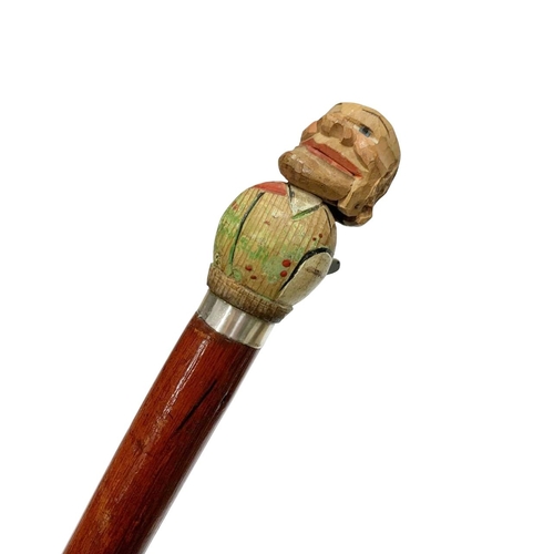 656 - Folk Art stained red hardwood automaton walking cane of balding gentleman, depressing the lever leng... 