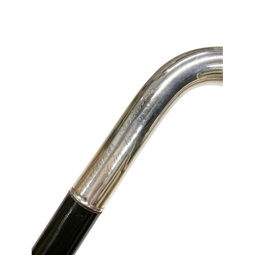 658 - Ebonised hardwood walking cane with Alpacca silver crook handle, engraved with dedication and marked... 