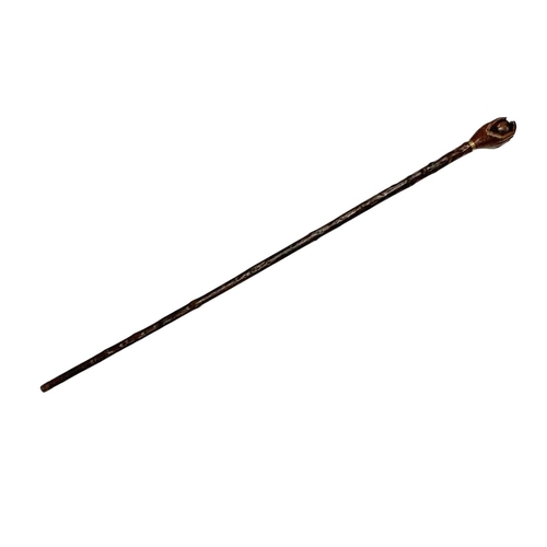 661 - Folk Art hazel wood walking cane with handle carved as a hand holding a ball, with thin metal collar... 