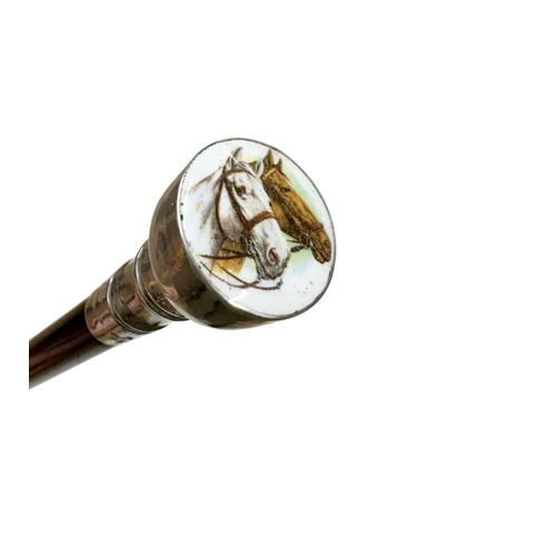 662 - Ebonised hardwood shaft walking cane with silver stepped cap handle having inset enamel of two horse... 