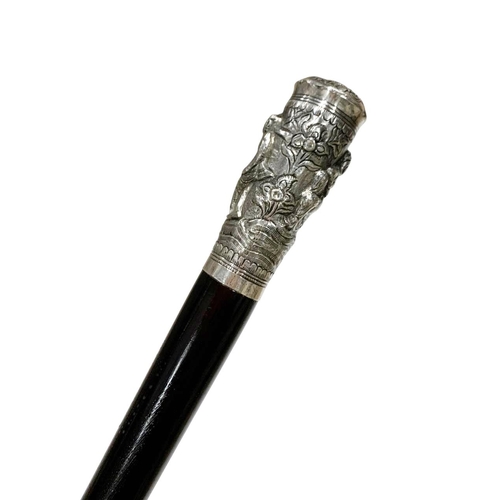 666 - Polished hardwood shaft walking cane with silver handle, having dancing Asian figures and central fl... 