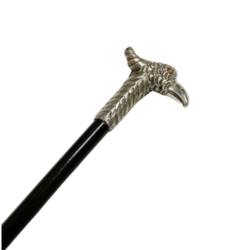 670 - Ebonised hardwood walking cane with Silver bird handle, the handle depicting a slim crested bird wit... 