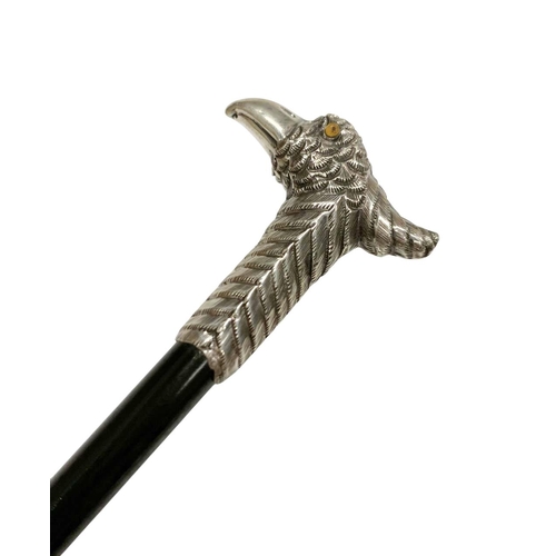 670 - Ebonised hardwood walking cane with Silver bird handle, the handle depicting a slim crested bird wit... 