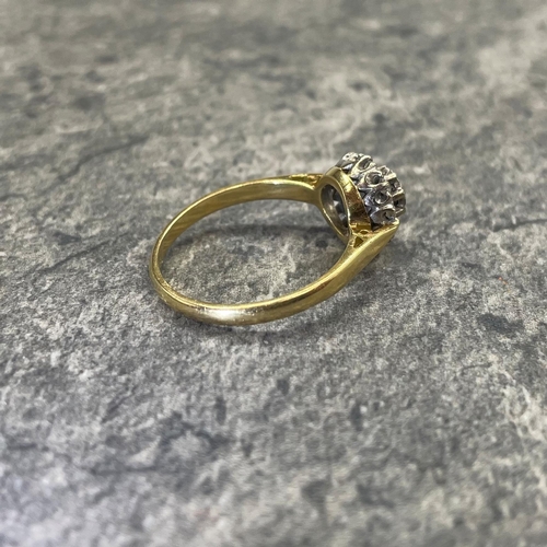 44 - Good 18ct and diamond halo ring, central stone .30ct, framed by eight smaller diamonds, size Q, 3.9g