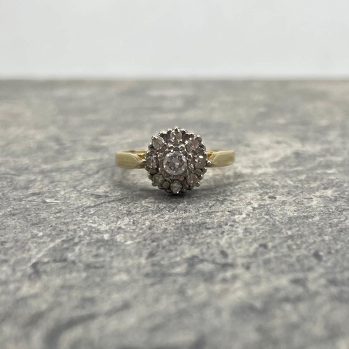 44 - Good 18ct and diamond halo ring, central stone .30ct, framed by eight smaller diamonds, size Q, 3.9g