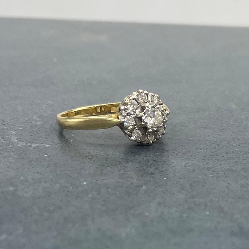 44 - Good 18ct and diamond halo ring, central stone .30ct, framed by eight smaller diamonds, size Q, 3.9g