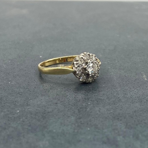 44 - Good 18ct and diamond halo ring, central stone .30ct, framed by eight smaller diamonds, size Q, 3.9g