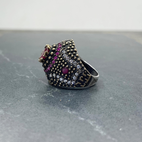 47 - Eccentric Indian silver, red and colourless paste cocktail type ring, central ruby 1ct approx, size ... 