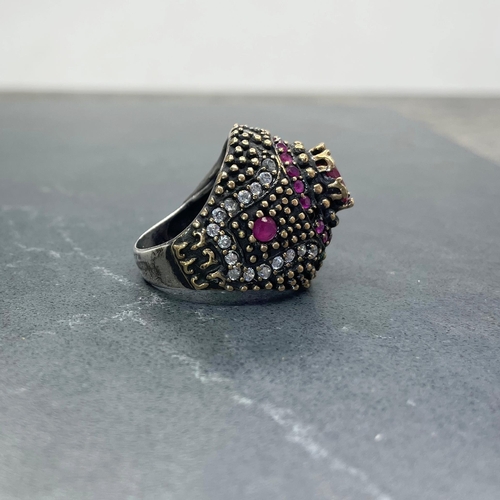 47 - Eccentric Indian silver, red and colourless paste cocktail type ring, central ruby 1ct approx, size ... 