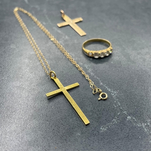 51 - Two 9ct cross pendants and fine chain, 2.6g, with an unmarked yellow metal and paste five stone ring... 
