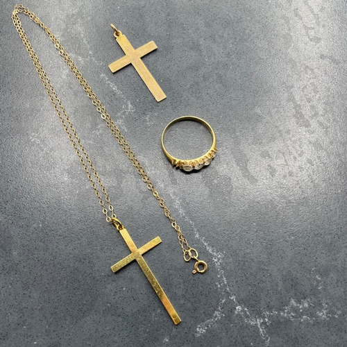 51 - Two 9ct cross pendants and fine chain, 2.6g, with an unmarked yellow metal and paste five stone ring... 