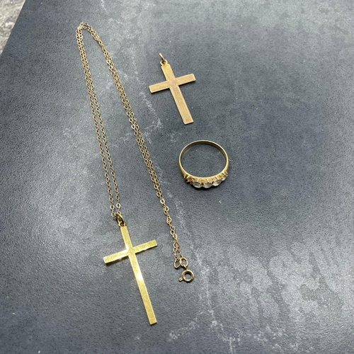 51 - Two 9ct cross pendants and fine chain, 2.6g, with an unmarked yellow metal and paste five stone ring... 