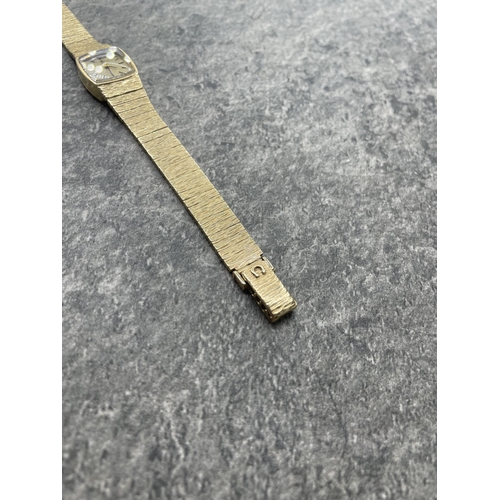 6 - Omega ladies 9ct integral bracelet watch, 16mm case, cream dial with gilt hands and markers, manual ... 
